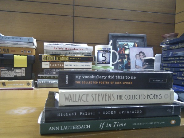 Foreground: four books from the personal canon. Background: lots of other significant stuff.